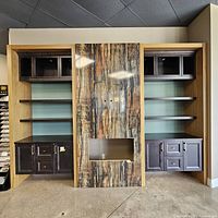 Full assembled wall unit showing side sections, base cabinets, floating shelves, columns and center panel