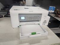 Front view with paper tray extended showing overall unit