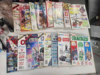 All sixteen Cracked magazines laid out in two rows