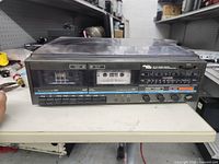 Front view showing Electro Brand stereo system controls and cassette deck