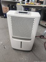 Front view showing grille and bucket slot