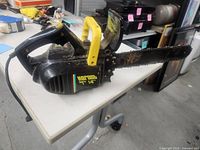 Full view of Hornet Mark II 14" electric chain saw on table