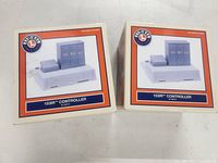 Two boxed Lionel 153IR Controllers front view