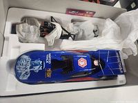 Diecast funny car body and chassis in styrofoam tray