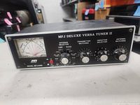 Front view with model designation, meter and control knobs visible