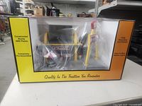 Front of boxed Rail King McDonald’s restaurant model, sealed in plastic window box