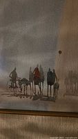 Close-up image of the painting showing group of people silhouettes, some with a bicycle and a balloon, shadow effects and muted color palette.