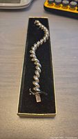 Full view of sterling silver twisted spiral link bracelet in display box