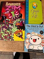 Front cover image showing Invader Zim, Bart Simpson's Guide to Life, and The Odd 1s Out books.