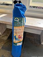 Blue carrying bag with ESCORT branding and product information label