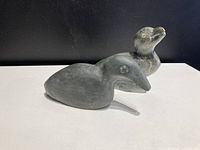 Pair of Inuit stone carved birds shown together, one 4 inches and the other 3 inches tall.