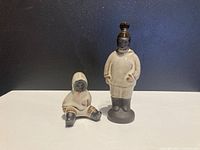 Two ceramic Greenlandic figurines by Hyllested Denmark shown from front