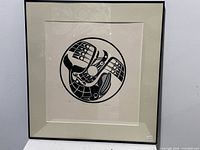 Framed artwork showing the full silkscreen print with abstract circular design.