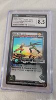 Front side of graded DragonBall-Z Black Fist Lock card showing the artwork and stats with holographic effect and CGC 8.5 label.