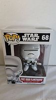 Photo of the First Order Flametrooper Funko Pop vinyl figure in its original unopened box, clearly showing the item number and name on the packaging.