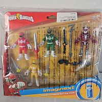 Front view of packaged Imaginext Power Rangers Battle Pack showing three Power Rangers figures and multiple weapons inside blister pack.