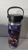 Full view of the thermos showing black lid with handle and detailed Star Wars artwork on the body.