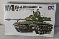 Front view of the sealed box showing illustration of the assembled M41 Walker Bulldog tank model and soldier figures with branding and model series details.