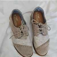 Full view of Toms women's lace-up oxford shoes, size 9.5, showing beige and taupe color canvas and suede material with laces tied.