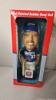 Front view of bobblehead in original red, white, and blue box showing Mike Piazza in Dodgers uniform number 37 with bat