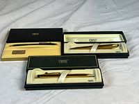 Three Cross pens in their original presentation boxes
