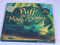 Front cover of the book showing the title, authors, and illustrator with illustrated dragon artwork.