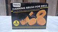 Front view of Pokuta 5-piece cleaning brush set box showing product image and pack size.