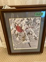 Framed print showing cardinals in snow within a dark wood frame, 13 x 10 inches size label visible.