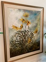 Full front view of signed floral painting in frame