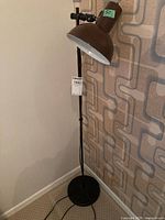 Full view of the 50-inch tall vintage metal floor lamp showing the base, pole, and shade.
