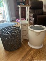 Photo showing the brown wicker basket, white wicker organizer with drawers, and white towel warmer together