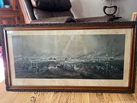 Full view of framed Battle of Gettysburg print in carved wooden frame