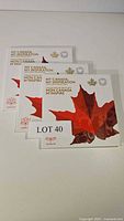 Four Canadian coin set holders with original foldout booklets showing empty coin slots.
