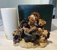 Photo showing Boyd's Bears collectible statue with several bears, pinecones, and open book, alongside the vanilla scented candle and original box