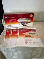 GBC HeatSeal Creative Laminator box with 3 packages of laminating pouches in front.