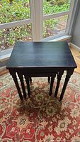 Large dark wood rectangular nesting table viewed from top