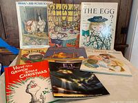 Photo showing all eight vintage children's books angled and fanned with colorful illustrated covers featuring animals, children, and story characters.