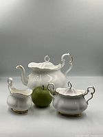 Three-piece Royal Albert Val D'or bone china set with reference apple