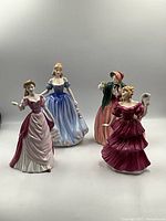 All four Royal Doulton figurines front view