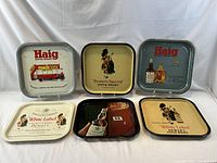 Front view of six trays showing all graphics