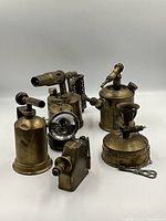 Group shot of all six brass mining tools