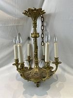 Front view of chandelier showing all six arms and bulbs