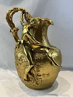 Full view front three-quarter of gilt bronze vase with female figure