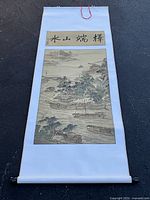 Full view of hanging scroll unrolled showing artwork and calligraphy