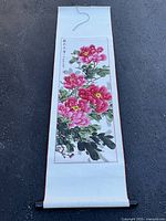 Full view of mounted scroll showing painting, mount, and roller