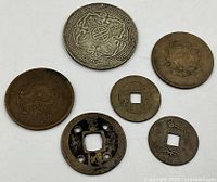 Front sides of six coins showing designs and patina