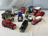 Group shot of all 12 diecast beer advertising vehicles