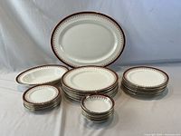 Full set showing platter, serving bowl, four stacks of plates and bowls