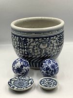 group shot of jardiniere, two balls, two dishes