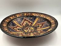 Oblique view of full plate showing decoration and rim